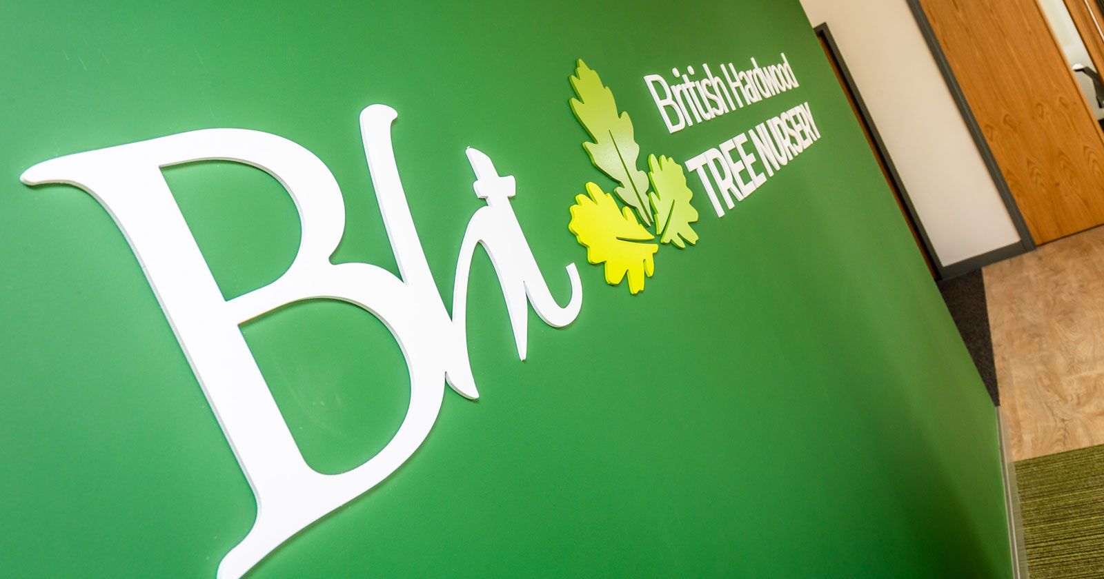 British Hardwood Tree Nursery feature wall signage and logo by APSS