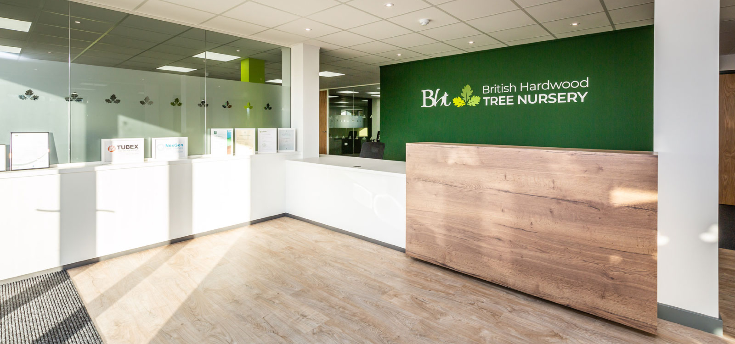 British Hardwood Tree Nursery reception desk and display area by APSS Joinery with Glass Partitions