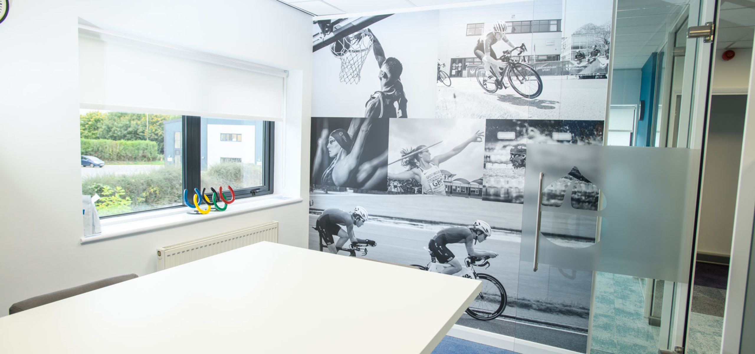Charnwood-Accountants-Sports-style-meeting-room-with-floor-to-ceiling-graphics-and-glass-partitions-by-APSS