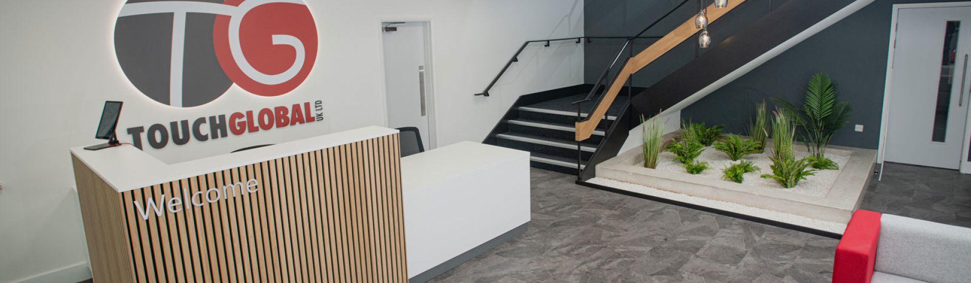 Touch Global Reception Area Refurb with bespoke joinery reception desk and Zen Garden by APSS